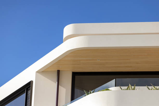 Closeup top part of modern new house, background with copy space, full frame horizontal composition